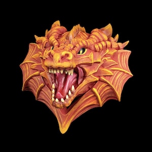 May include: A detailed, orange and yellow dragon head sculpture with an open mouth, revealing sharp white teeth and a red interior. The dragon has yellow eyes and wing-like structures on the sides, set against a black background.