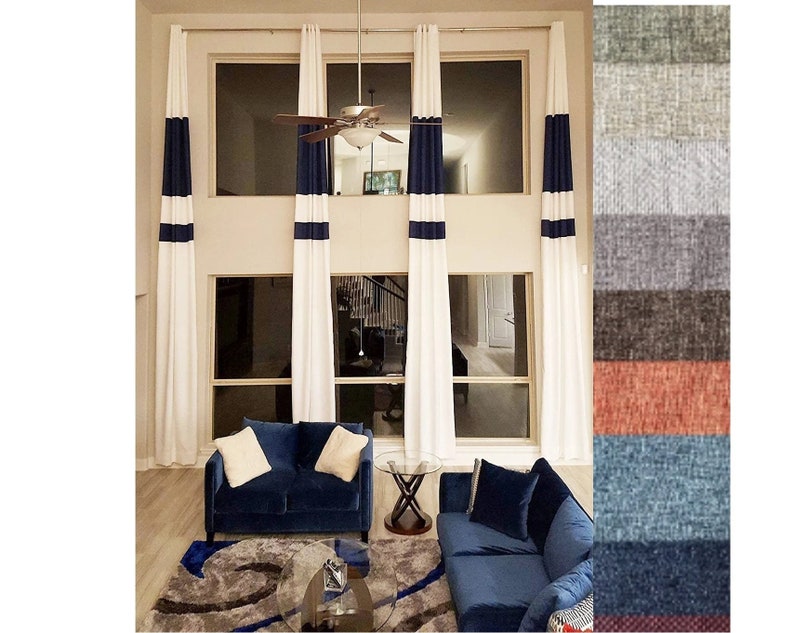 May include: A living room featuring white curtains with navy blue stripes, a navy blue sofa, and a patterned rug. A color swatch of fabric samples is on the right side of the image. The room has large windows and a ceiling fan.
