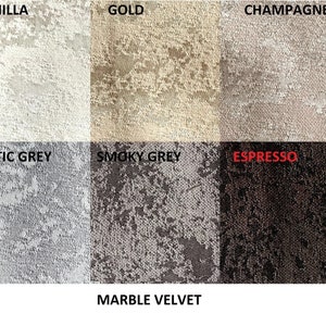 May include: A fabric swatch display featuring six color options of marble velvet. Colors include vanilla, gold, champagne, arctic grey, smoky grey, and espresso. The text "MARBLE VELVET" is at the bottom of the image.