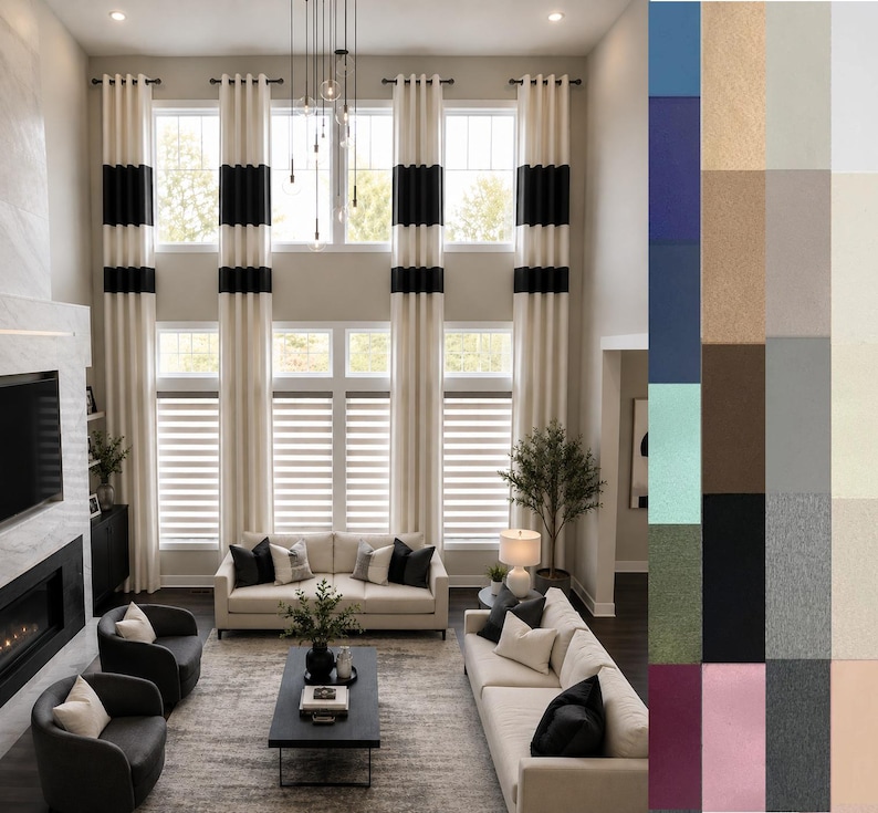 May include: Living room with tall, cream-colored curtains accented with black bands. The room features a fireplace, two sofas, and two armchairs. The windows have blinds, and the room is decorated in neutral tones.