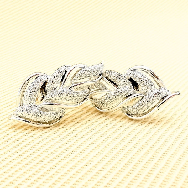 Vintage Coro Silver-Toned Clip-On Earrings With Abstract Leaf or Flame Design and Textured Accents | 1960s