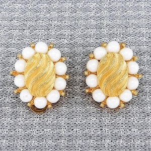 Vintage Matte Gold-Toned Marvella Clip-On Earrings With Oval-Shaped Design, Wavy Pattern, & White Acrylic Beads | 1970s or 1980s