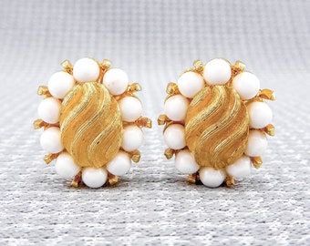 Vintage Matte Gold-Toned Marvella Clip-On Earrings With Oval-Shaped Design, Wavy Pattern, & White Acrylic Beads | 1970s or 1980s