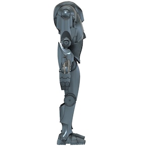 Puede incluir: Un robot gris met&aacute;lico con forma humanoide. El robot tiene una cabeza grande con un ojo redondo negro. Los brazos del robot est&aacute;n doblados en los codos y sus manos est&aacute;n cerradas en pu&ntilde;os. Las piernas del robot est&aacute;n rectas y sus pies son planos.