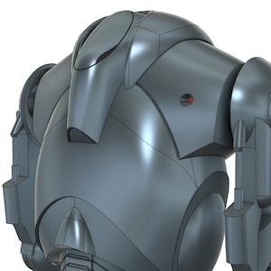 Puede incluir: Un robot gris met&aacute;lico con un cuerpo redondeado y brazos articulados. El robot tiene una cabeza grande y redonda con una peque&ntilde;a luz roja en la parte delantera.