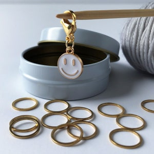 Gold Circle Ring Stitch Markers with Enameled Happy Face Charm in Storage Tin - snag free knitting