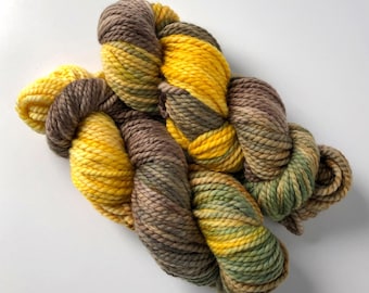 Variegated Yarn in Spicy Brown Mustard with shades of yellow, brown, and olive, 2-ply bulky weight merino wool, 109 yards