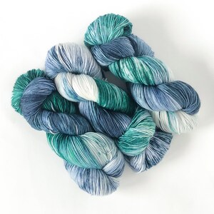 Hand Dyed variegated sock yarn in "Pacific Coast" - blue, forest green, white - quantity discounts - caking service (read item description)