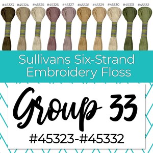 May include: A group of 10 spools of Sullivans Six-Strand Embroidery Floss in various colors, including green, brown, beige, and pink. The spools are labeled with the numbers #45323 through #45332. The text "Group 33" is written in large, bold letters below the spools.