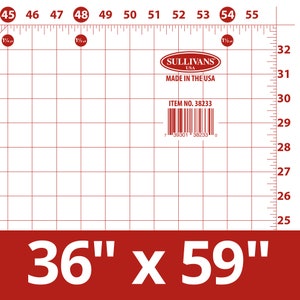 May include: A white cutting mat with a red grid pattern and measurements in inches. The mat is labeled "Sullivans USA" and "Made in the USA." It measures 36" x 59".