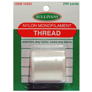 May include: A spool of white nylon monofilament thread, labeled "SULLIVANS NYLON MONOFILAMENT THREAD", with the text "matches any color, sews any fabric" and "200 yards" printed on the packaging.