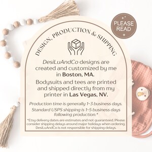 May include: A wooden sign with the text "DESIGN, PRODUCTION & SHIPPING" and additional text about the business. A pacifier and bib are visible on the right. A decorative wooden bead garland and tassel are in the background.