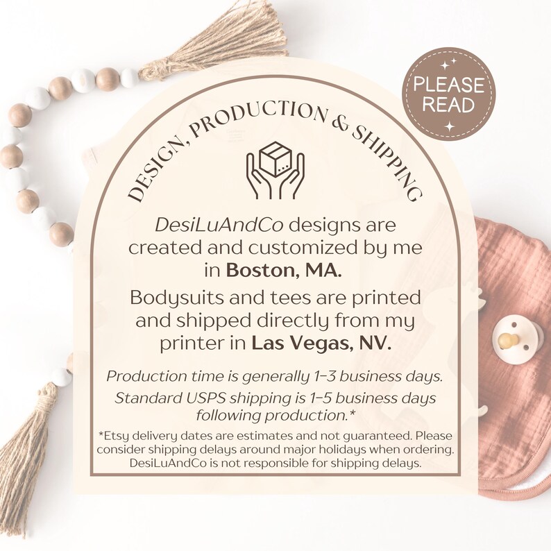May include: A wooden sign with the text "DESIGN, PRODUCTION & SHIPPING" and additional text about the business. A pacifier and bib are visible on the right. A decorative wooden bead garland and tassel are in the background.