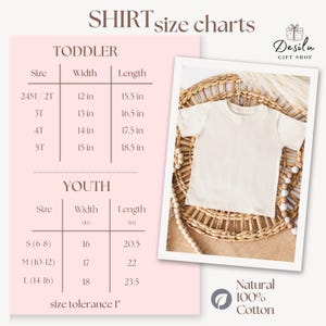 May include: A cream-colored t-shirt displayed on a woven surface, next to a shirt size chart. The chart lists toddler and youth sizes with width and length measurements in inches. The shirt is made of 100% natural cotton.