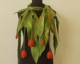 May include: A green felted scarf with orange felt flowers. The scarf is draped over a mannequin and has a long, flowing design.