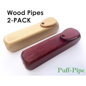 May include: Two wooden pipes, one natural wood color and one dark red, with a 2-PACK label and the text "Puff-Pipe".