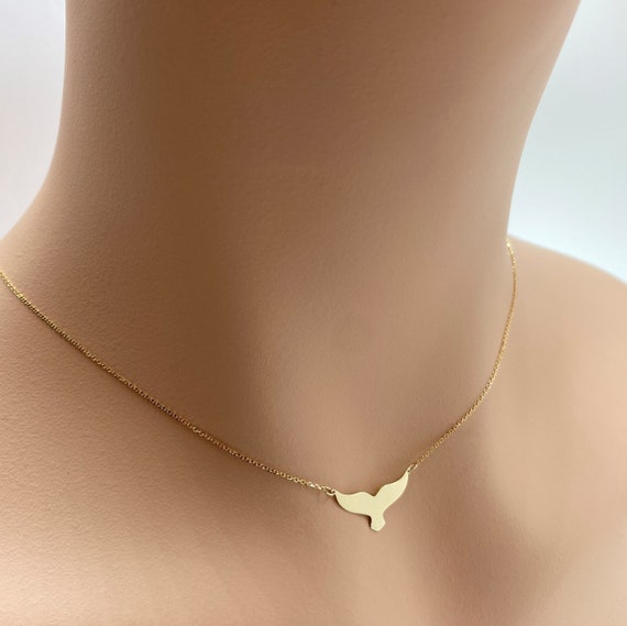 Amazon.com: Gold whale tail necklace, dainty black cord necklace with a gold  plated whale fin pendant, surfer necklace, gift for her, nautical beach  jewelry : Handmade Products