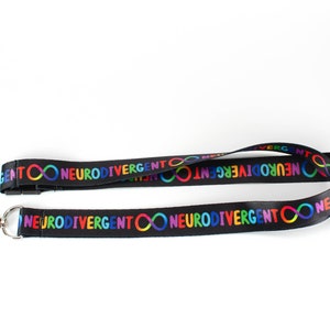 May include: Black lanyard with a repeating pattern of the text "Neurodivergent" and a rainbow infinity symbol.