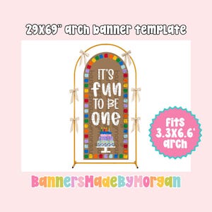 Puede incluir: Una plantilla de pancarta arqueada de 29x69 pulgadas con fondo marrón y borde cuadrado colorido. El texto dice IT'S FUN TO BE ONE sobre un gráfico de pastel de cumpleaños. La pancarta está en un marco de arco de metal dorado con lazos beige.