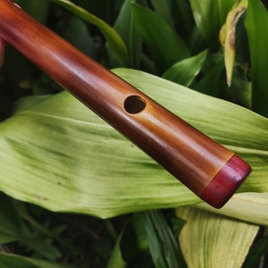 A Minor harmonic Bamboo Flute. Rustic handmade flute. Ethnic flute in A harmonic minor.