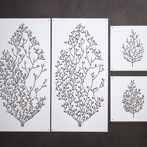 May include: Four white panels featuring black tree branch designs. Two large rectangular panels and two smaller square panels. The tree branch designs vary slightly, creating a cohesive set for wall decor.