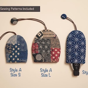 May include: Three fabric key fob covers in various styles and sizes. The covers feature blue, brown, and red patterns. Text includes "3 Sewing Patterns Included", "Style A Size S", "Style A Size L", and "Style B".