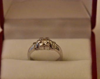 14kt white gold ring with flower motif . Set with 7 zircons, size 53, weight 5gr. One of a kind, handcrafted.