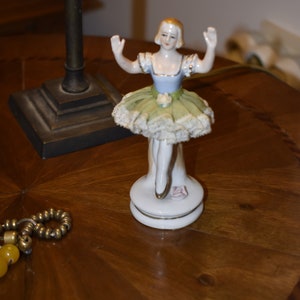 porcelain figurine, antique statuette of seated ballarina, Dresden type lace skirt. Handpainted , Japan 1940s - 13 cm. height.