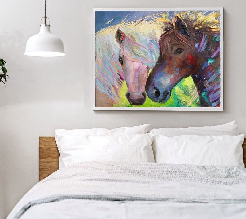 May include: A painting of two horses, one white with a pink mane and the other brown with a purple mane, looking at each other. The background is a colorful abstract design.
