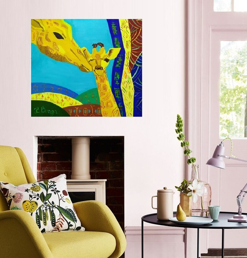 May include: A colorful painting of two giraffes, one adult and one baby, with a blue background and yellow, orange, and green accents. The adult giraffe is nuzzling the baby giraffe. The painting is signed "L. Bragg" in the bottom left corner.