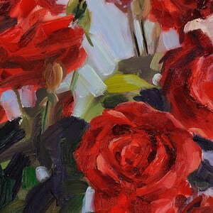 May include: Close-up of a vibrant oil painting featuring several red roses in full bloom. The petals display rich shades of red, with hints of white and green foliage. The artwork has visible brushstrokes, creating a textured and dynamic floral arrangement.