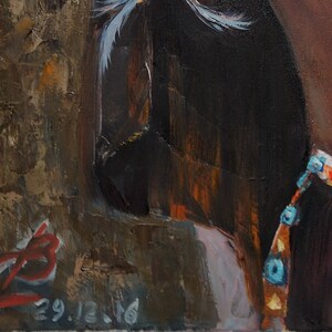May include: A close-up of a painting depicting a Native American woman wearing a beaded necklace and a feathered headdress. The painting is signed and dated "29.12.76".