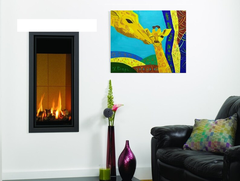 May include: A colorful painting of two giraffes, a mother and her baby, with a blue background and yellow, green, and red accents. The painting is framed and hanging on a white wall.