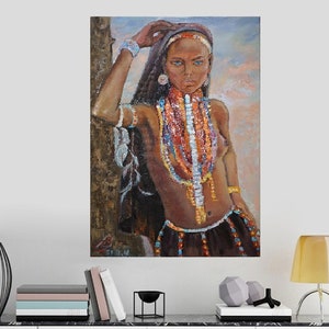 May include: A painting of a woman with dark hair and blue eyes wearing a variety of colorful beaded necklaces. She is standing with her hand on a tree trunk and looking off to the side.