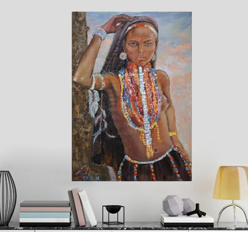 May include: A painting of a woman with dark hair and blue eyes wearing a variety of colorful beaded necklaces. She is standing with her hand on a tree trunk and looking off to the side.