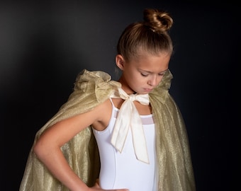 Gold tulle cape, taffeta bow