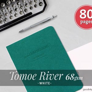 May include: A teal notebook with the embossed text good INKPRESSIONS LETTERPRESS handmade stationery, a silver mechanical pencil, a typewriter, and a red circular graphic with the white text 80 pages. The text Tomoe River 68gsm -WHITE- is visible.