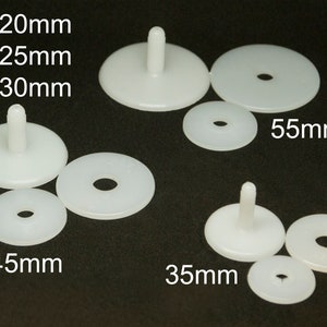 May include: Assortment of white plastic safety eyes for crafts and toys. The eyes come in different sizes: 20mm, 25mm, 30mm, 35mm, 45mm, and 55mm.