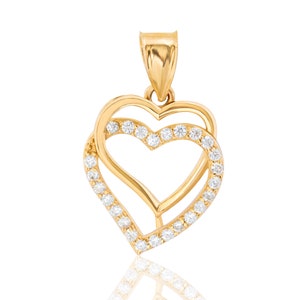 May include: A gold pendant necklace featuring two interlocking hearts, each outlined with sparkling clear cubic zirconia stones.