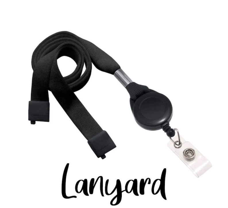 May include: Black retractable lanyard with a black clip and a clear badge holder. The lanyard is made of a woven fabric and has a metal swivel hook.