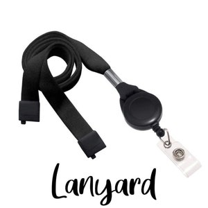 May include: Black lanyard with a retractable reel and a clear plastic badge holder. The lanyard is made of a woven fabric and has a black plastic clasp. The word "Lanyard" is written in a script font.