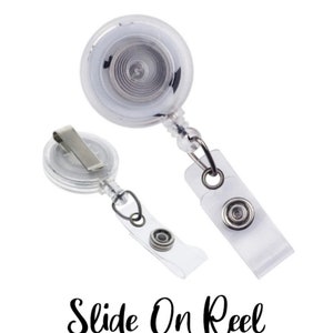 May include: Two clear plastic badge reels with a retractable cord and a metal clip. One reel has a clear plastic strap with a snap closure. The text "Slide On Reel" is written in a cursive font.
