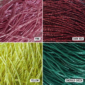 May include: Close-up of four sections of craft supplies. The top left is pink, the top right is dark red, the bottom left is yellow, and the bottom right is emerald green. Each section is labelled with its colour name.