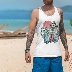 May include: A white tank top featuring a graphic print of a stylized figure with a beard, wearing traditional robes, positioned in front of a large red circle. The figure holds a yellow and green yin-yang symbol, surrounded by blue and green dragon-like creatures.