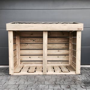 May include: A wooden log storage rack with a slatted design and a black label that says "Belgium".