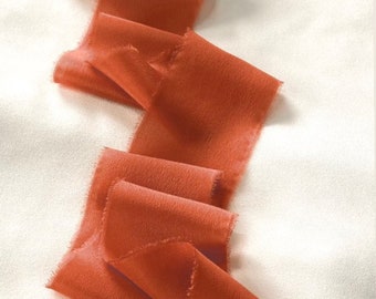 Hand dyed raw edged crepe de chine silk ribbon approx 5cmx3m in a shade of orange spice