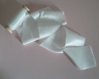 Hand dyed organic bamboo silk ribbon measuring approx 2"x3m in 'palest ivory’ soft white