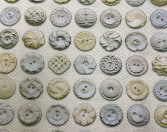 May include: A fabric with a repeating pattern of various beige and gray buttons. The buttons are all different shapes and sizes, and some have intricate designs.