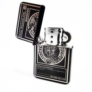 May include: A black and silver lighter with a Dark Magician Girl card design. The lighter is open and the card design is visible on both the top and bottom of the lighter. The card text reads "[SPELLCASTER/EFFECT]  Level 7 DARK Spellcaster/Effect  ATK/2000 DEF/1700".