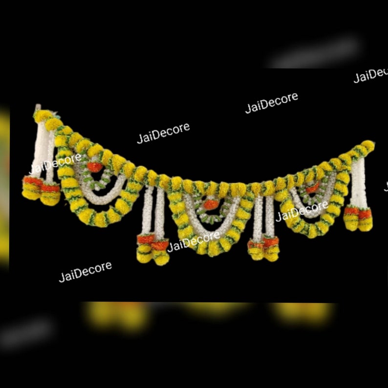 May include: A yellow and white garland made of artificial flowers. The garland is decorated with small orange flowers and is perfect for adding a festive touch to any occasion.
